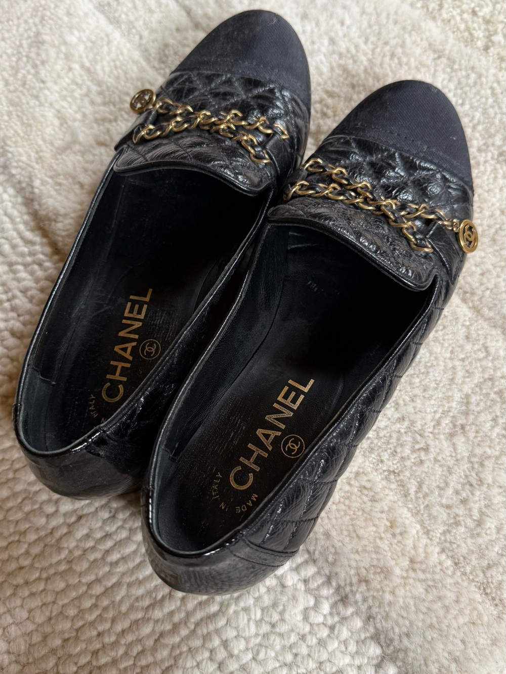 CHANEL Black Quilted Leather Chain-Accent Loafers